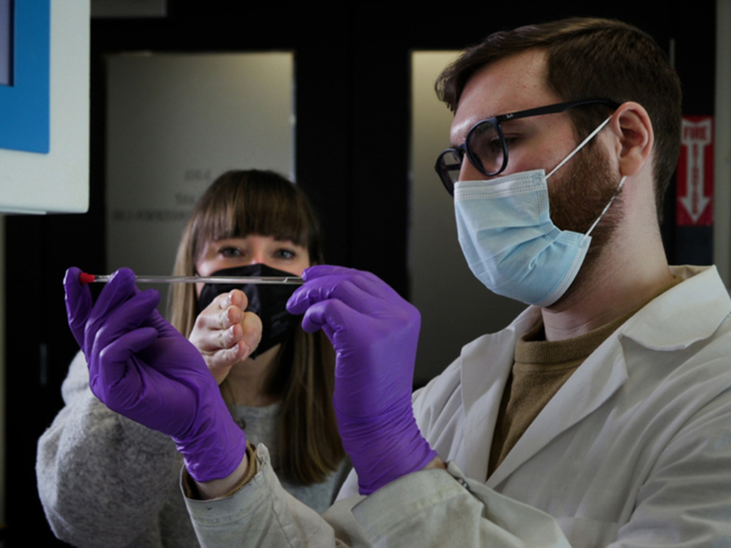 Associate Professor Betar Gallant (left) and her team study electrochemical transformations related to energy storage in batteries. Here, she discusses electrolyte analysis for calcium batteries with graduate student Aaron Melemed.