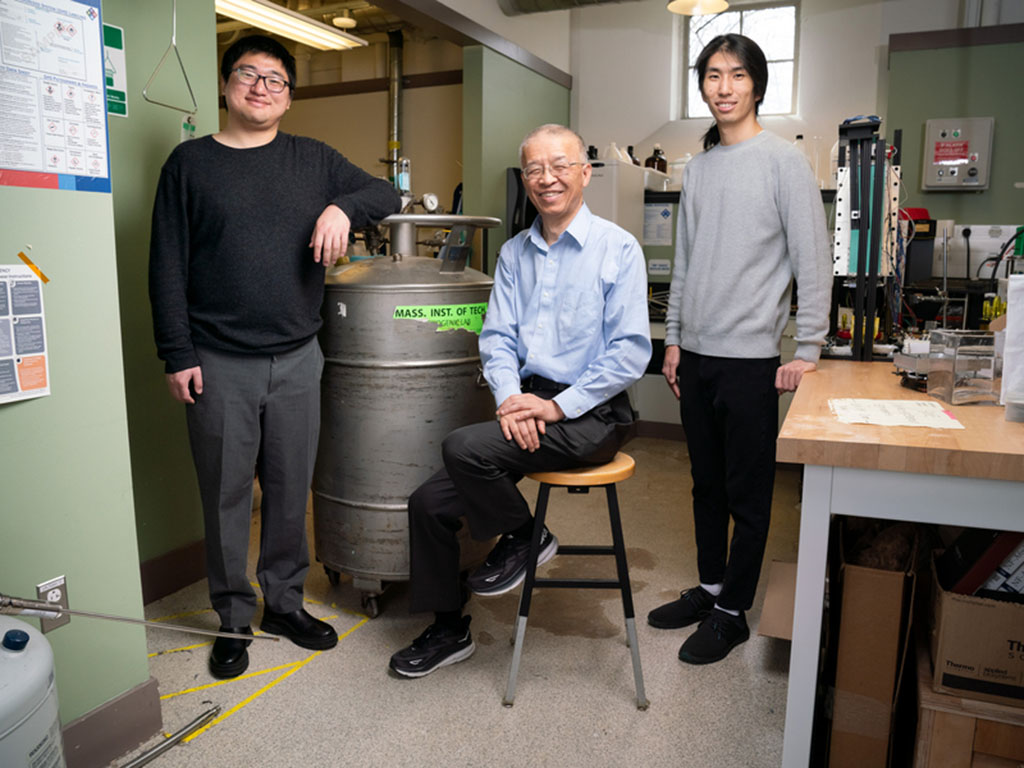 Gang Chen, pictured in center, says. Chen stands with authors Guangxin Lv, on left, and James Zhang. Author Yaodong Tu is not pictured.