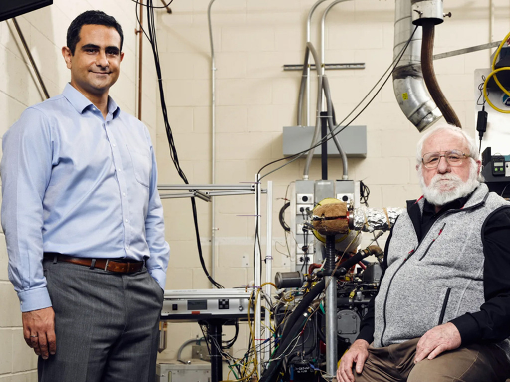 Emmanuel Kasseris and Leslie Bromberg with machinery in background